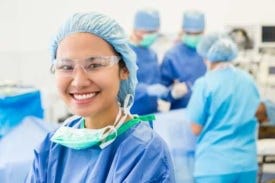 Doctor smiling in surgical gear