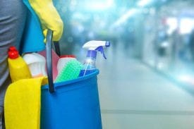 Cleaning products in blue bucket